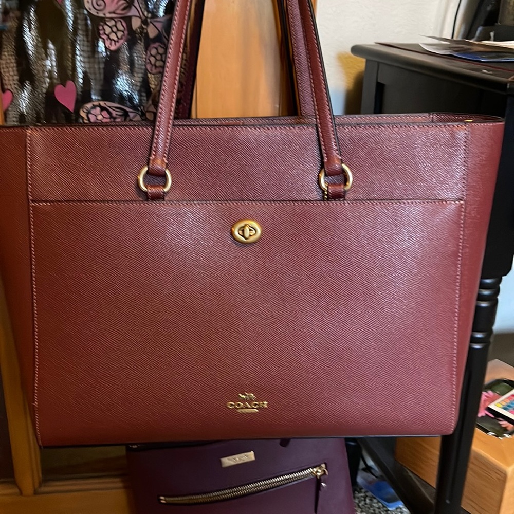 New without tags authentic Coach laptop bag for 15” laptop.  Includes dust bag.